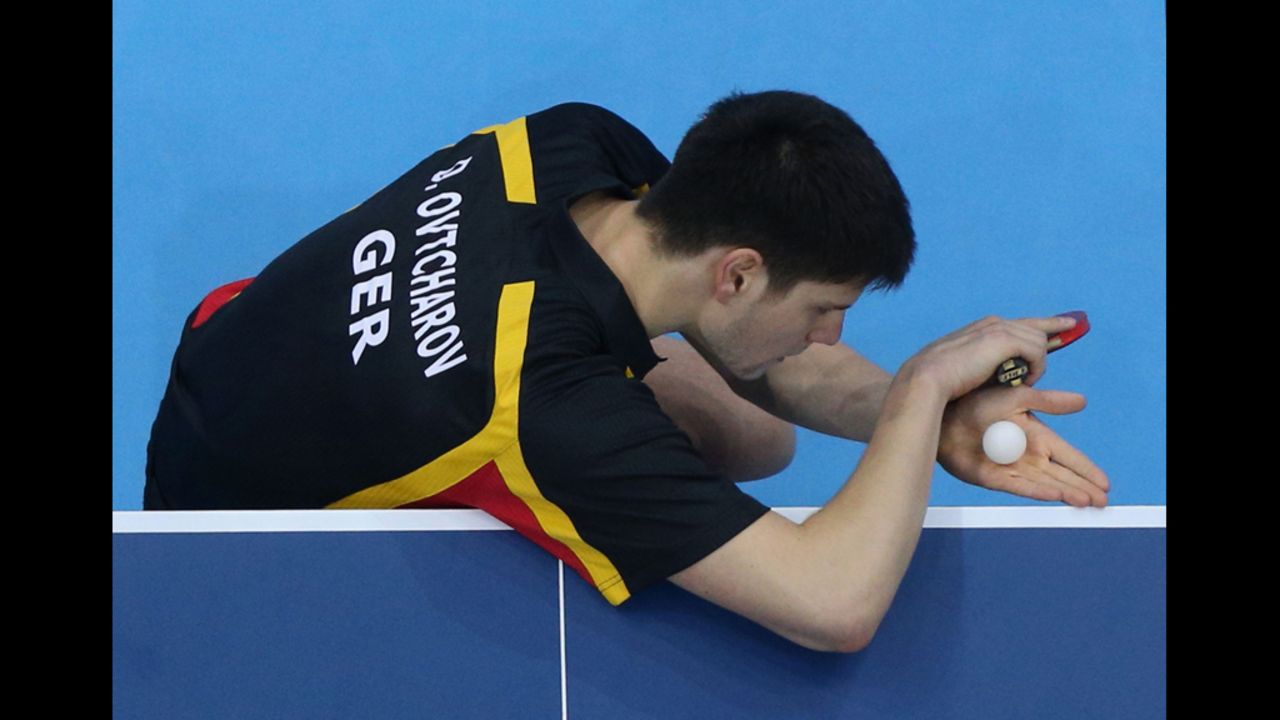 Germany's Dimitrij Ovtcharov addresses the ball during the bronze-medal table tennis match. The ball did not respond, remembering better days with former Detroit Tigers pitcher Mark Fidrych.
