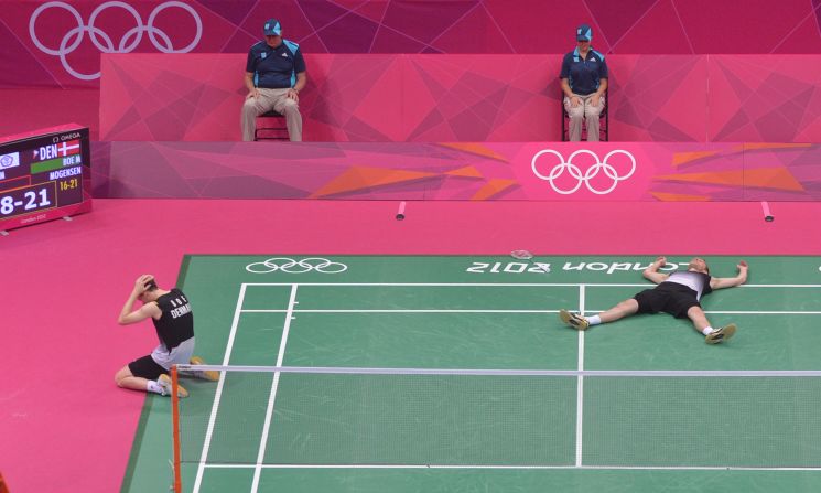 Mathias Boe, left, and Carsten Mogensen of Denmark celebrate their victory over Taiwan during the semifinal men's doubles badminton match.