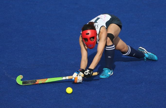 Akane Shibata of Japan takes a shot during the women's hockey preliminary match between South Korea and Japan.