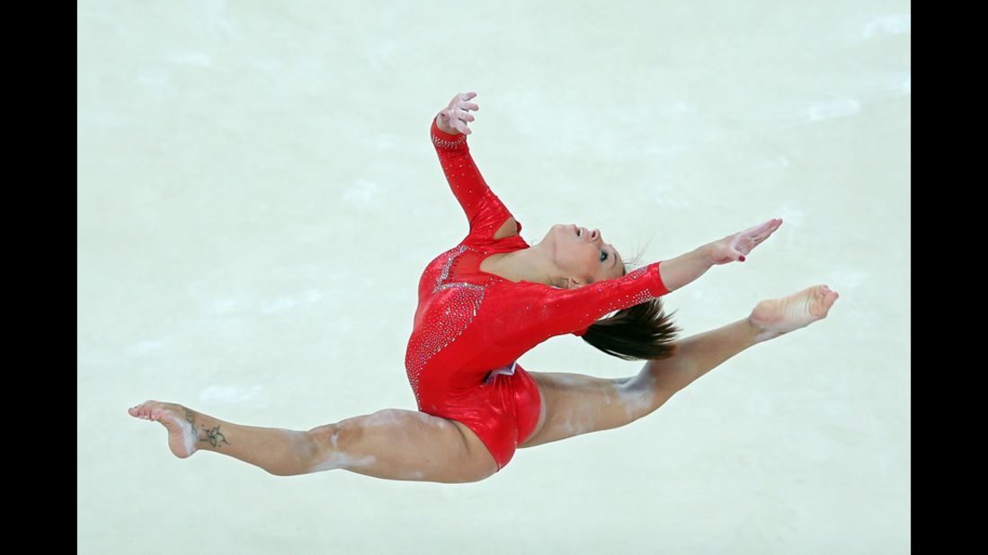 Italy's Vanessa Ferrari competes in the floor exercise in the artistic gymnastics women's individual all-around final.