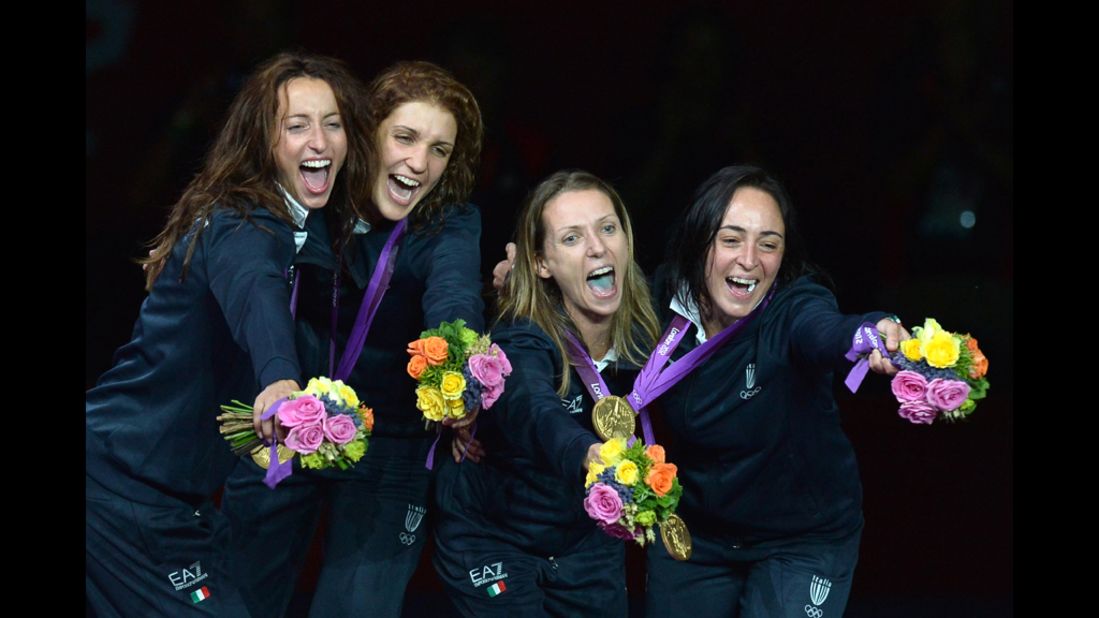 Left to right: Italy's Elisa Di Francisca, Arianna Errigo, Valentina Vezzali and Ilaria Salvatori celebrate with their gold medals on the podium of the women's foil final as part of the fencing event.