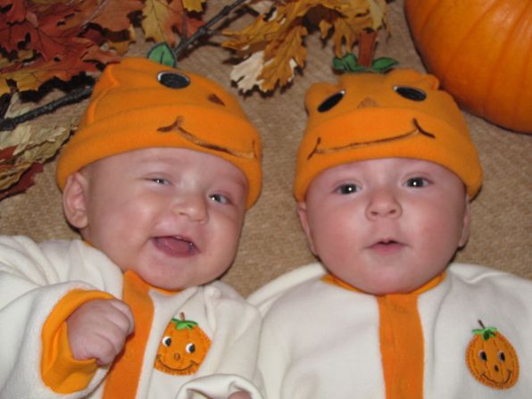 Nelly and Michael dressed their twins up as pumpkins for Halloween in 2009. 
