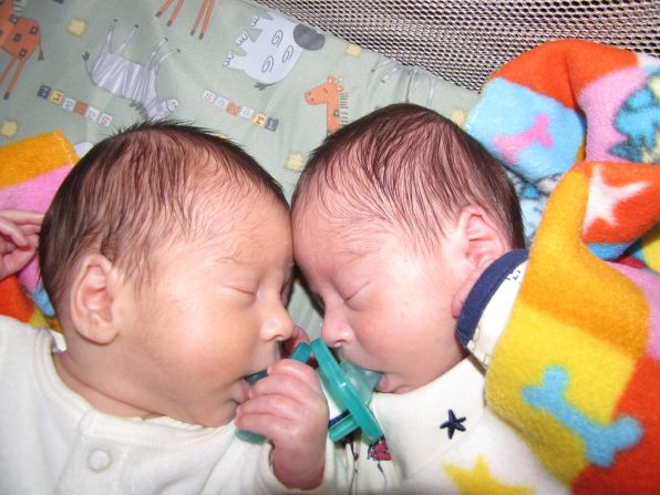 Patrick, right, curls up with brother Andrew on Patrick's first day home from the hospital in July 2009. 