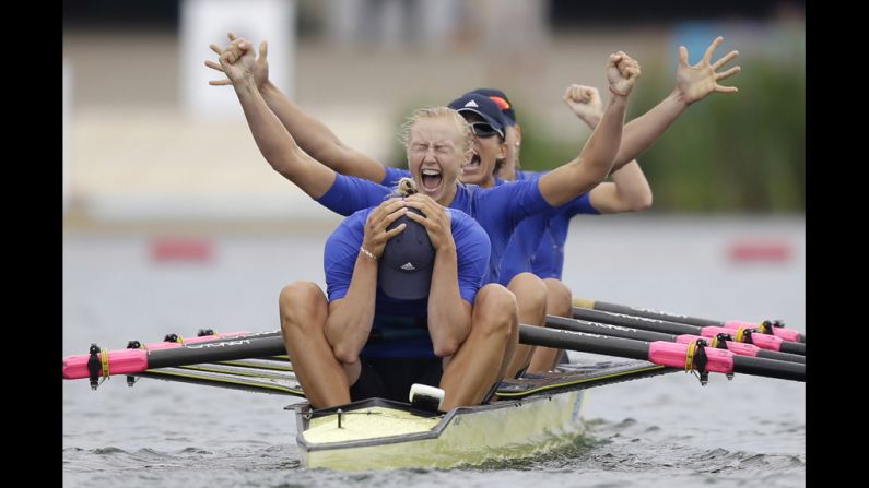 Yana Dementieva, foreground, Anastasiia Kozhenkova, Nataliya Dovgodko, and Kateryna Tarasenko of Ukraine celebrate their win after the women's rowing quadruple sculls final in Windsor, England, on Wednesday, August 1. Check out <a href="index.php?page=&url=http%3A%2F%2Fwww.cnn.com%2F2012%2F07%2F31%2Fworldsport%2Fgallery%2Folympics-day-four%2Findex.html" target="_blank">Day 4 of competition</a> from Tuesday. The Games ran through August 12. 