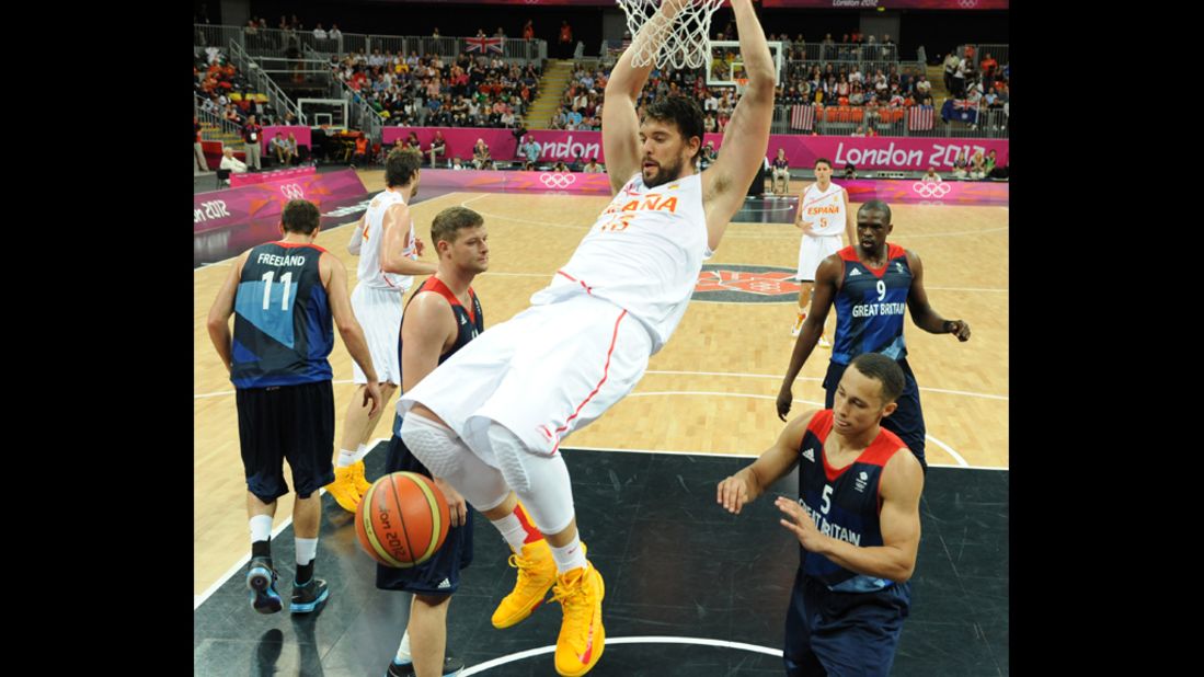 Spain's Victor Sada scores during the men's basketball preliminary round match between Spain and Britain.