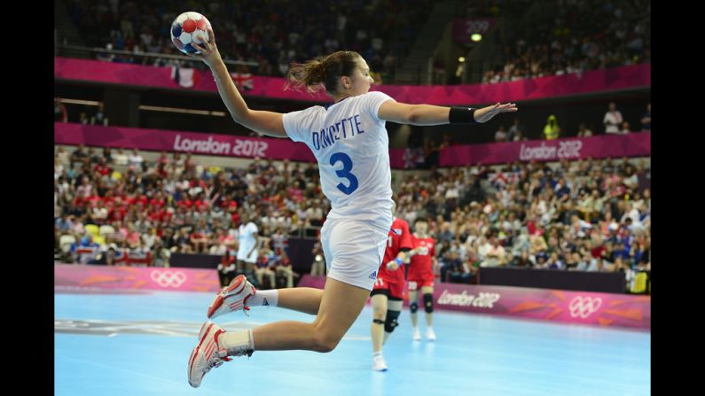 France's Blandine Dancette jumps to shoot during a women's preliminary handball match between South Korea and France.