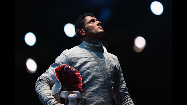 Italy's Aldo Montano awaits a decision during the men's saber team fencing quarterfinal against Aliaksandr Buikevich of Belarus.