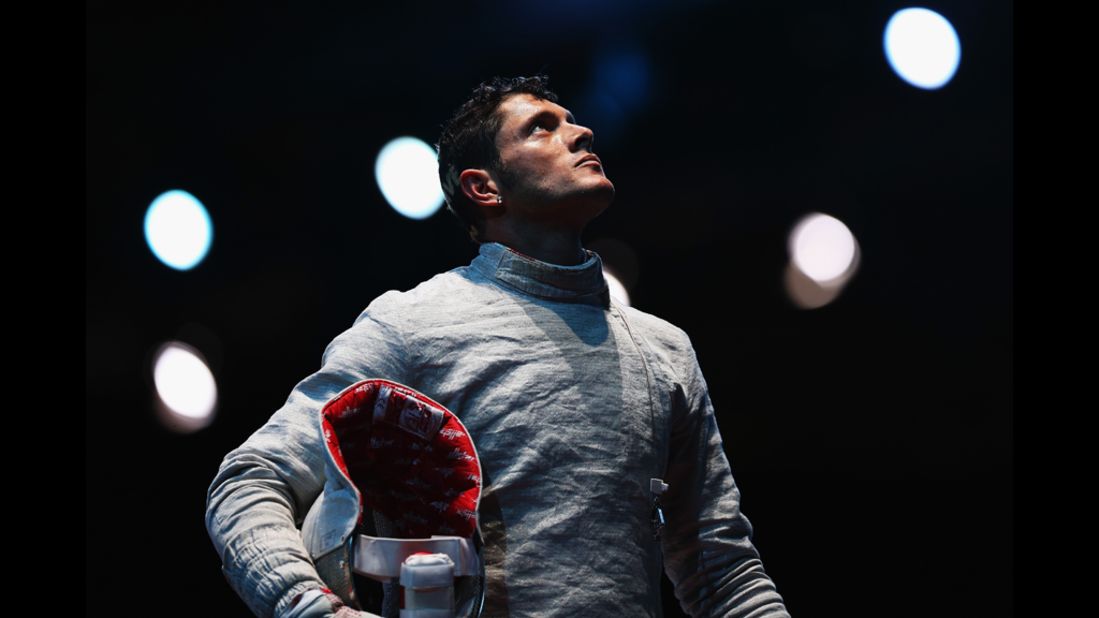 Italy's Aldo Montano awaits a decision during the men's saber team fencing quarterfinal against Aliaksandr Buikevich of Belarus. 