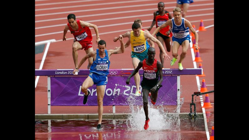 Italy's Yuri Floriani, left, and Kenya's Brimin Kiprop Kipruto compete in the men's 3,000-meter steeplechase.