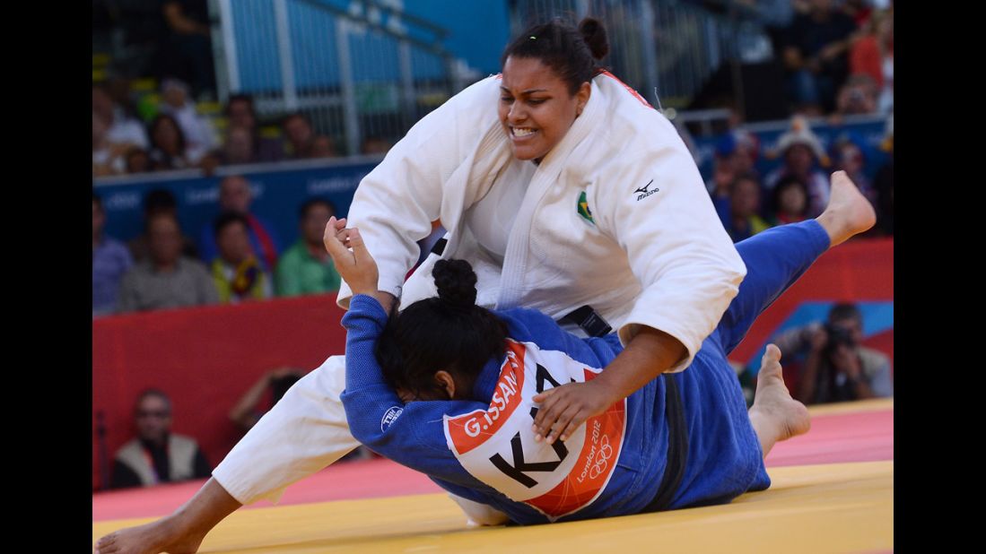 Brazil's Maria Suelen Altheman, in white, competes with Kazakhstan's Gulzhan Issanova during the women's over 78-kilogram judo repechage match.
