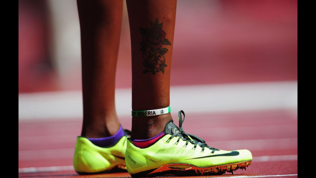 Regina George of Nigeria shows off some colorful footwear before the women's 400-meter heats. 