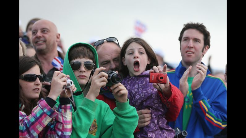 Fans take in the Olympic atmosphere on Day 7 at Eton Dorney, the rowing venue in Windsor, England.