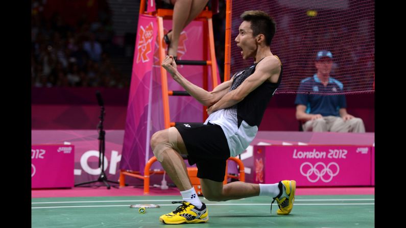 Malaysia's Chong Wei Lee celebrates winning the men's singles badminton semifinal against Long Chen of China.