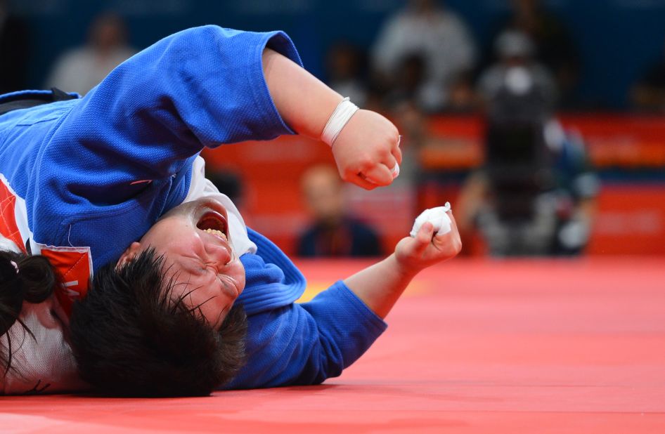 China's Tong Wen celebrates her victory in the women's over 78-kilogram judo bronze medal match.