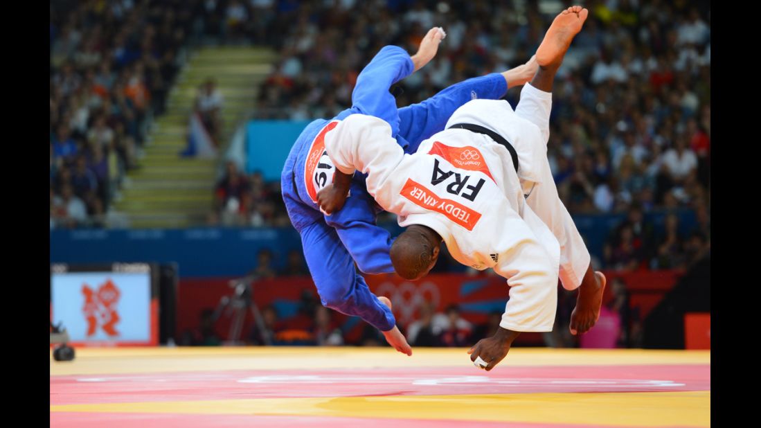 France's Teddy Riner, right, fights Russia's Alexander Mikhaylin to win the gold in the men's over 100-kilogram judo final on Friday.