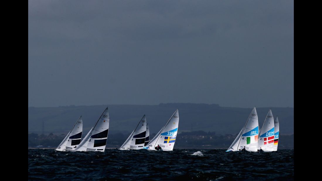 Competition gets under way in the men's Finn sailing in Weymouth, England.