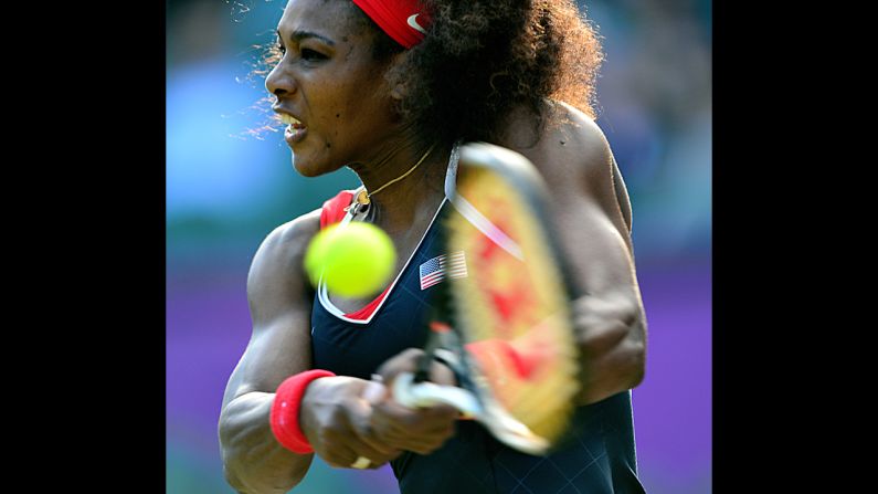 U.S. player Serena Williams makes a return against Victoria Azarenka of Belarus during their women's singles semifinal.