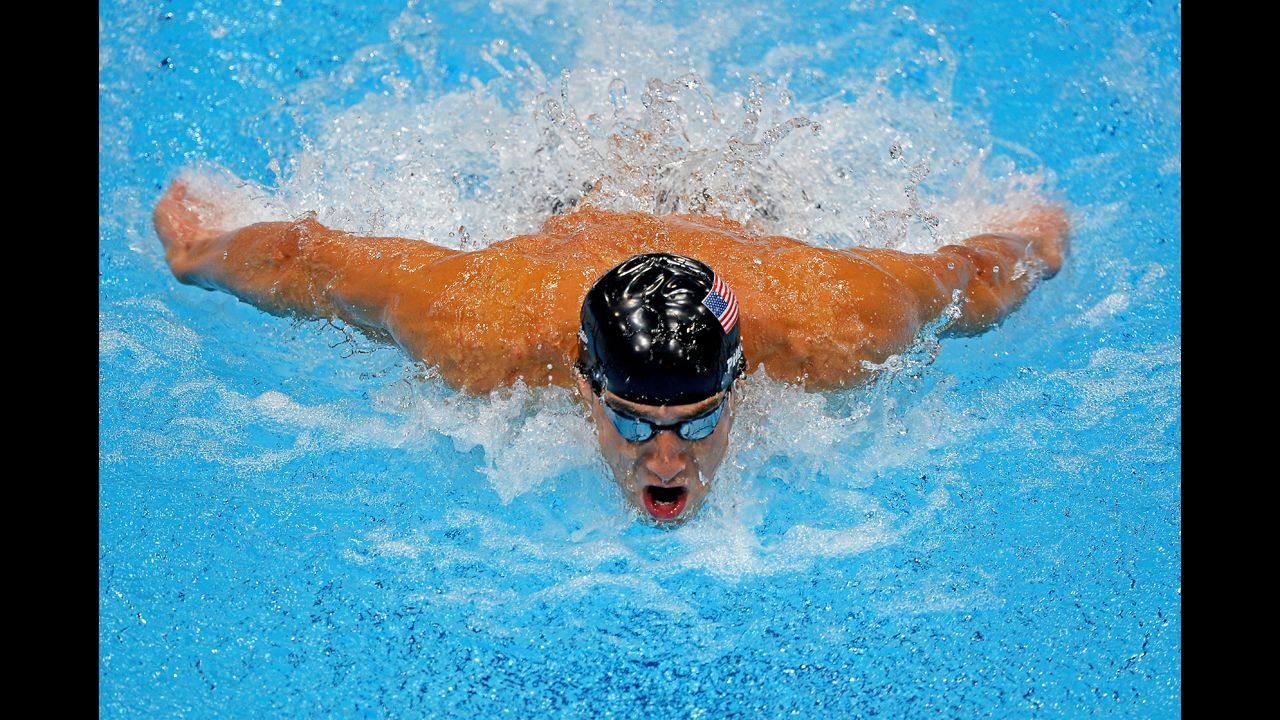 Michael Phelps competes in the men's 100-meter butterfly final.