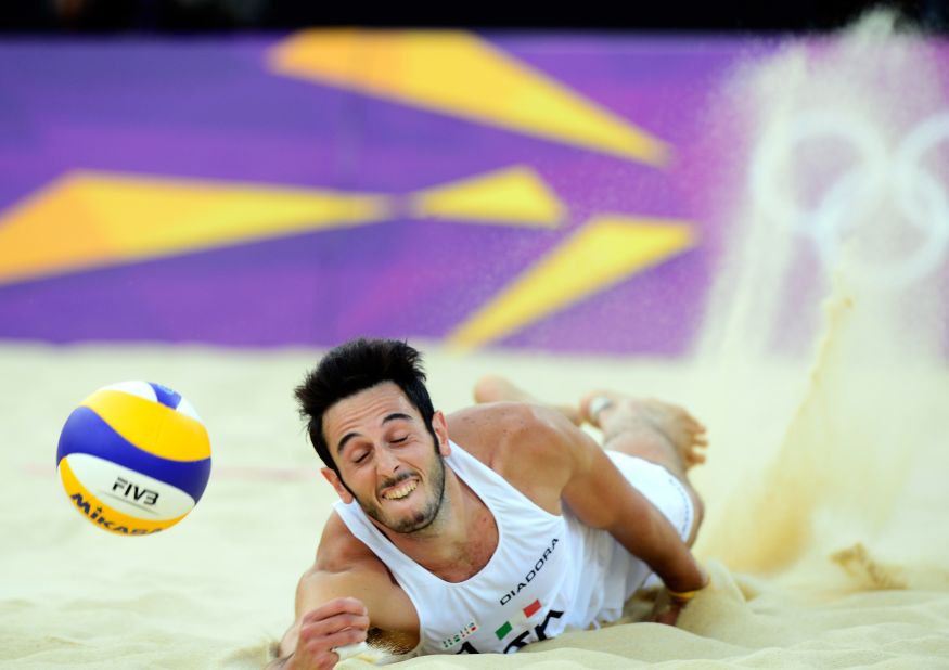 Italy's Paolo Nicolai dives for the ball during the men's beach volleyball match against Todd Rogers and Phil Dalhausser from the United States on Friday.