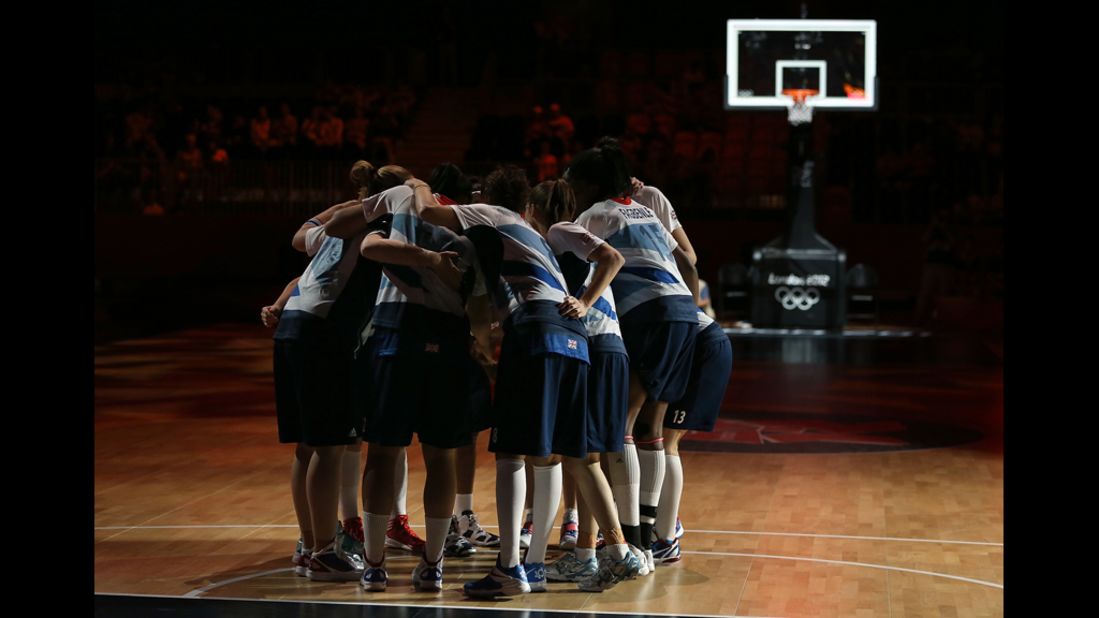 Great Britain huddles up before the women's basketball preliminary round match against France on Friday.
