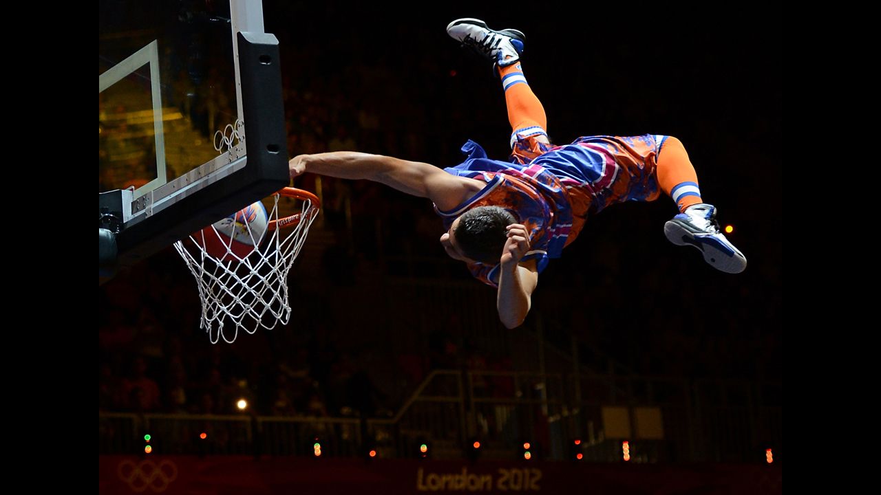 Spud Webb sneaks into Olympics, wins slam-dunk contest again.