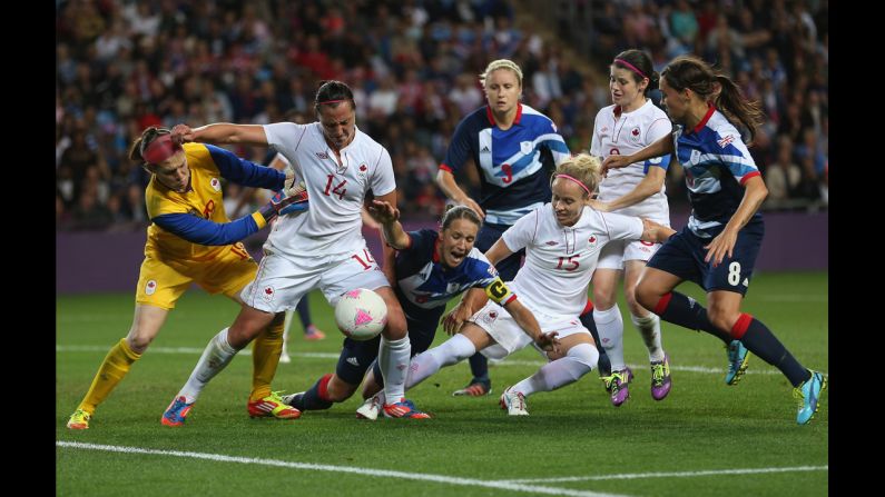 Casey Stoney of Great Britain goes down in the penalty box during the women's football quarter final match between Great Britain and Canada in Coventry, England.
