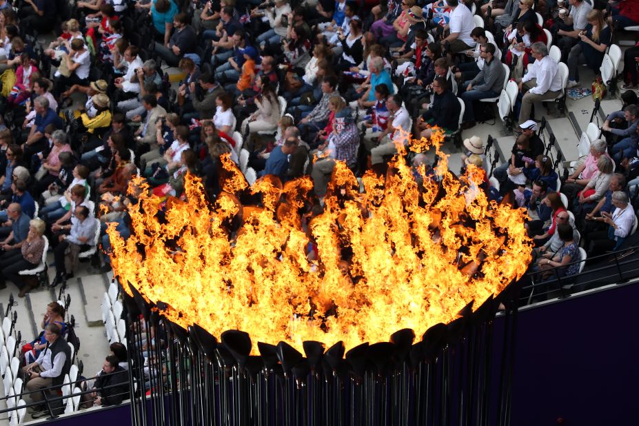 The Olympic Cauldron burns at the Olympic Stadium. 