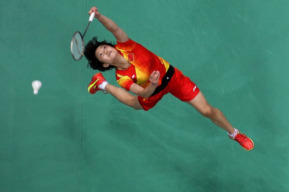 Xin Wang of China competes in the women's singles badminton semifinal at Wembley Arena.