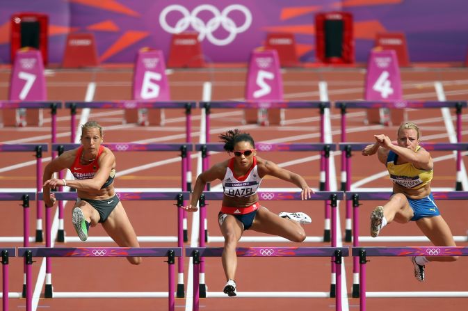 From left, Jennifer Oeser of Germany, Louise Hazel of Great Britain and Jessica Samuelsson of Sweden compete in the women's heptathlon 100-meter hurdles heat.