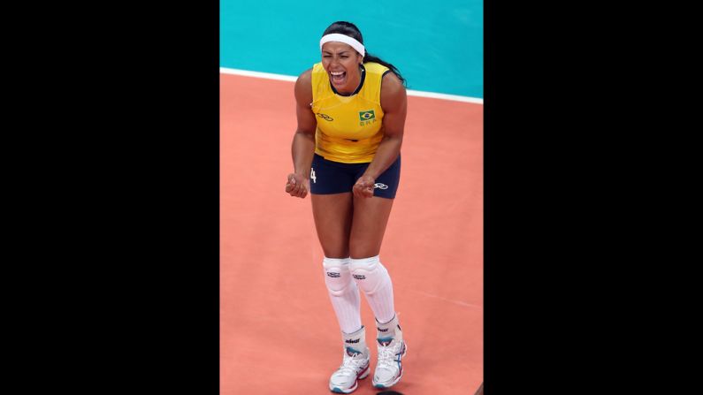 Paula Pequeno of Brazil celebrates a point in the first set against China during women's volleyball.
