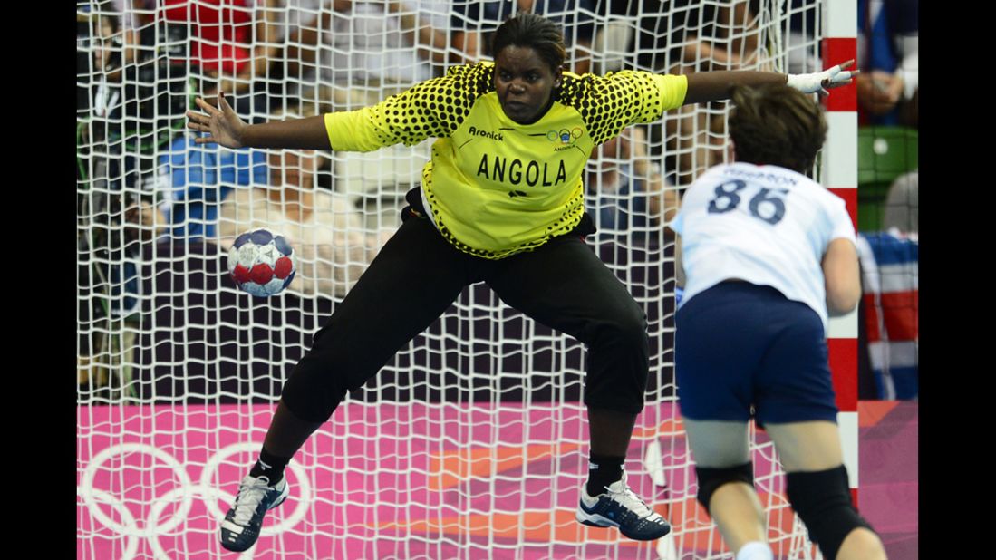 Angolan goalkeeper Cristina Direito tries to make a save during a women's preliminary handball match against Great Britain.
