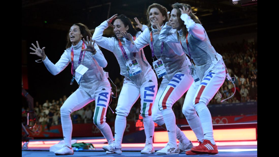 Left to right: Italy's Elisa Di Francisca, Arianna Errigo, Ilaria Salvatori and Valentina Vezzali celebrate winning gold during the women's foil final as part of the fencing event.