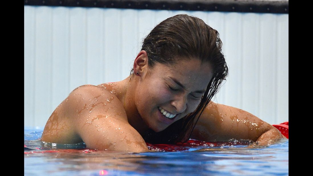 The Netherlands' Ranomi Kromowidjojo reacts to her gold medal win in the women's 100-meter freestyle final swimming event.