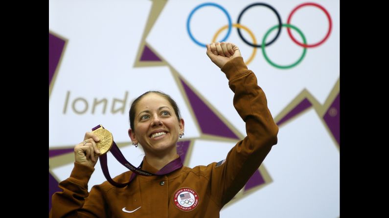 Gold medalist Jamie Lynn Gray of the United States celebrates on the podium after winning the 50-meter rifle 3 positions women's final Saturday, August 4.