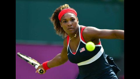 Serena Williams hits a return to Russia's Maria Sharapova during the women's singles tennis final on Saturday, August 4.