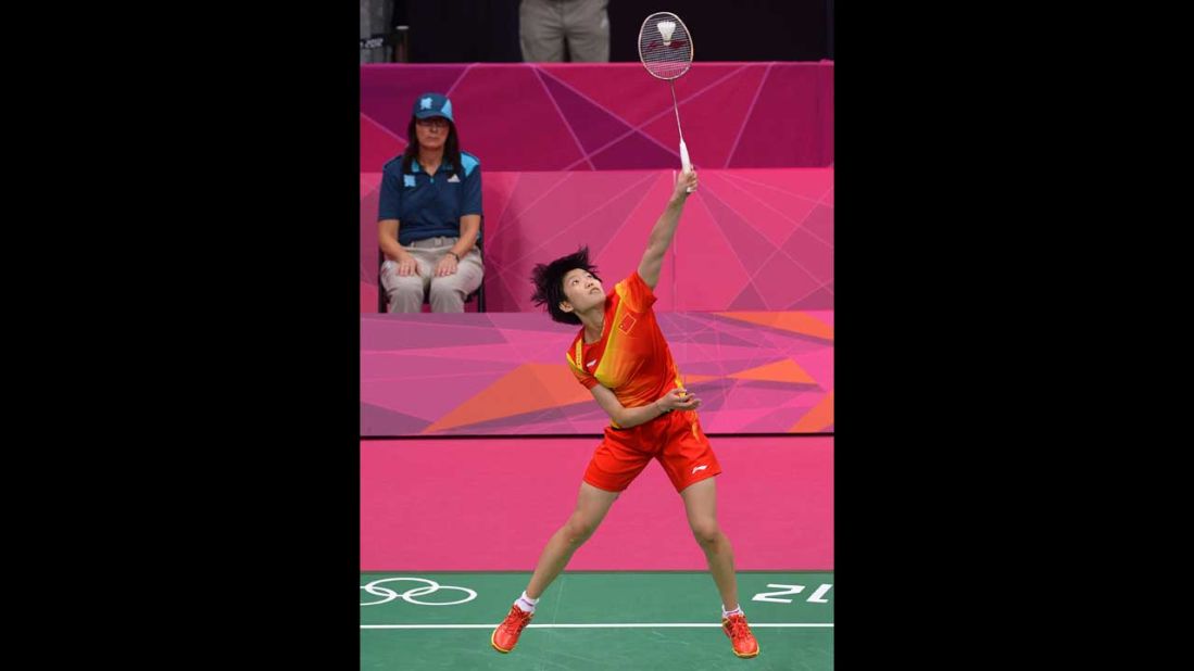 China's Wang Xin plays against India's Saina Nehwal in the bronze medal women's singles badminton match.