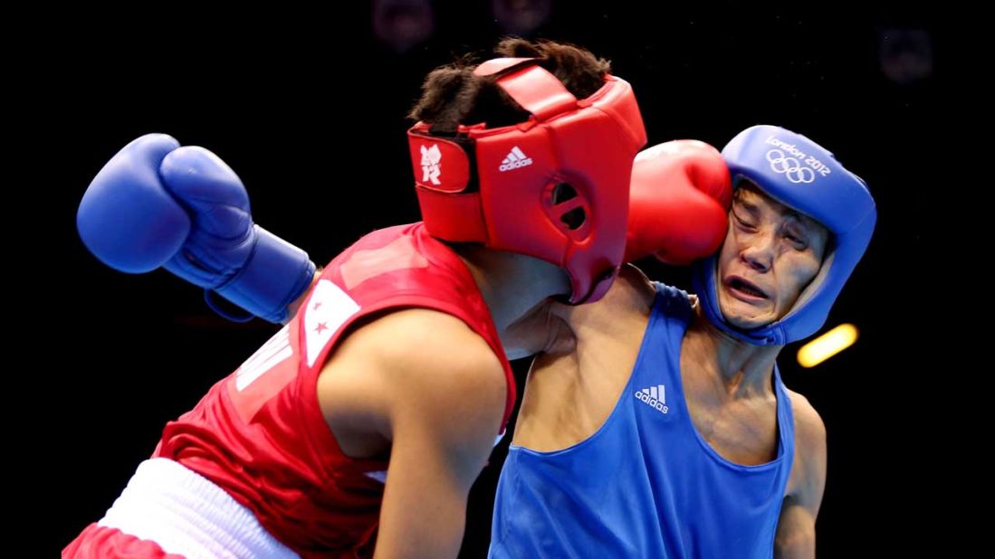 Left to right: Mark Barriga of the Philippines and Birzhan Zhakypov of Kazakhstan in action during the men's light fly (46-49 kilogram) boxing.