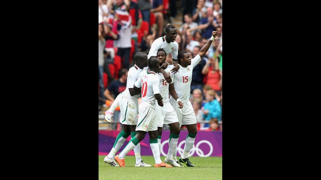 Senegal celebrates after Ibrahima Balde scored a goal during the men's football quarterfinal match against Mexico.