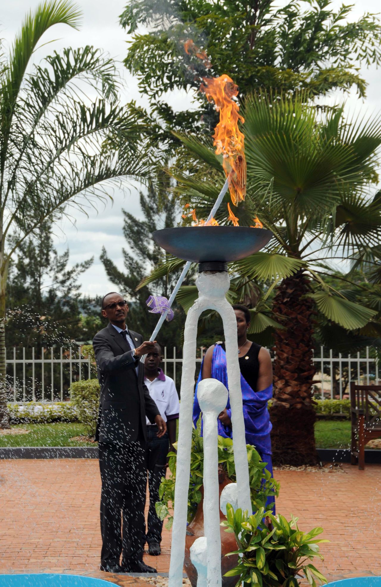 Rwandan President Paul Kagame lights a flame of remembrance to commemorate the genocide, which claimed approximately 800,000 lives in the span of 100 days -- including six of Niyonshuti's brothers and 60 of his extended family. 