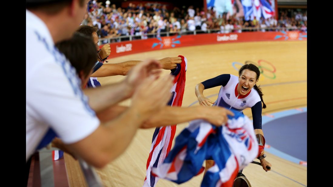 Dani King of Great Britain celebrates winning the gold medal and breaking the world record in women's team pursuit track cycling.