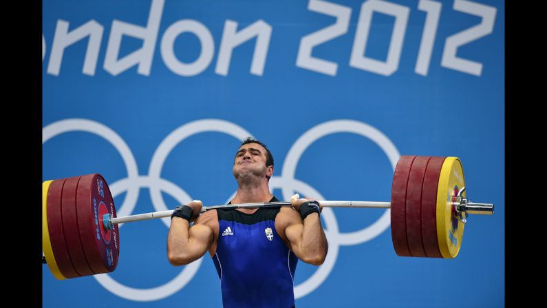 Greece's David Kavelasvili competes during the men's 94-kilogram group B weightlifting event.