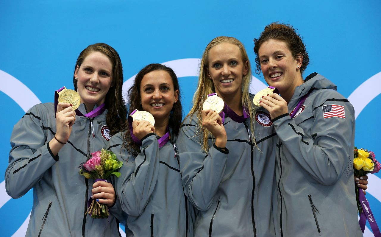 Left to right: Gold medalists Missy Franklin, Rebecca Soni, Dana Volmer, and Allison Schmitt pose during the medal ceremony for the women's 4x100-meter medley relay on Saturday, August 4.