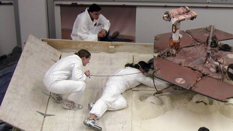 Scott Maxwell, top, Kim Lichtenberg, left, and Pauline Hwang test how to get Spirit out of a Martian "sand trap."