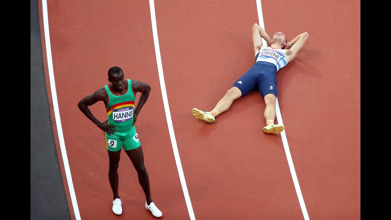 Left to right: Mamadou Kasse Hanne of Senegal and David Greene of Great Britain after competing in the men's 400-meter hurdles semifinal. Greene advanced; Hanne did not.
