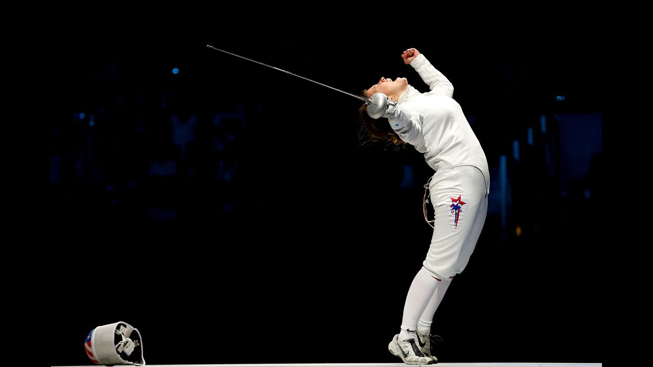 Courtney Hurley of the United States celebrates after she and her teammates defeated Russia in the the bronze medal match, 31-30, in women's epee team fencing.