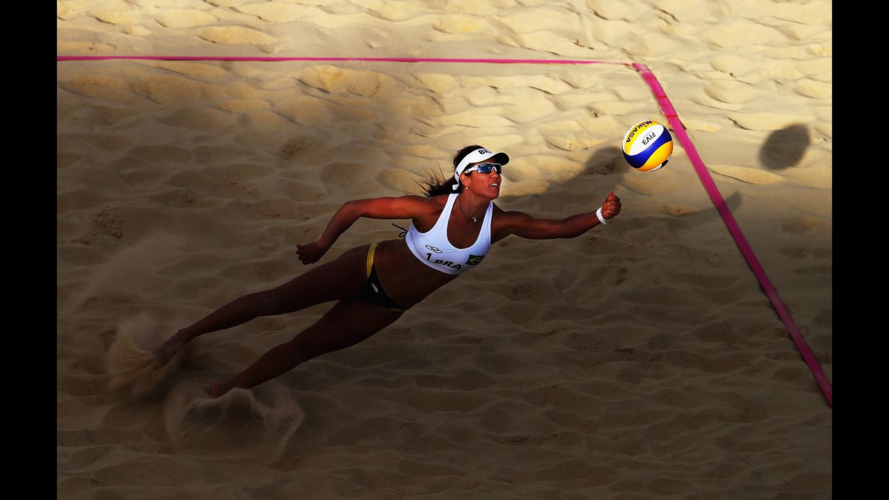 Maria Antonelli of Brazil dives for the ball during a women's beach volleyball round-of-16 match between Brazil and the Czech Republic.