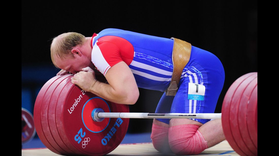 Andrey Demanov of Russia celebrates during the men's 94 kilogram weightlifting final.