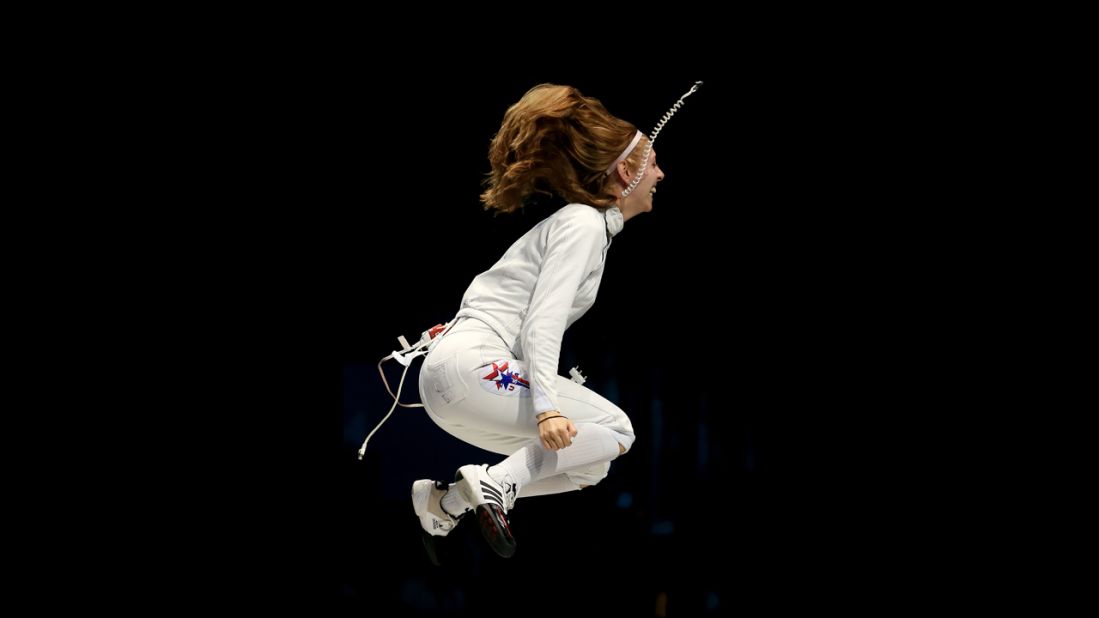 Susannah Scanlan of the United States celebrates her team's 31-30 victory against Russia in the bronze medal match in women's epee team fencing.