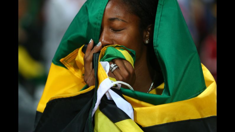 Shelly-Ann Fraser-Pryce of Jamaica celebrates winning the gold in the women's 100m final.