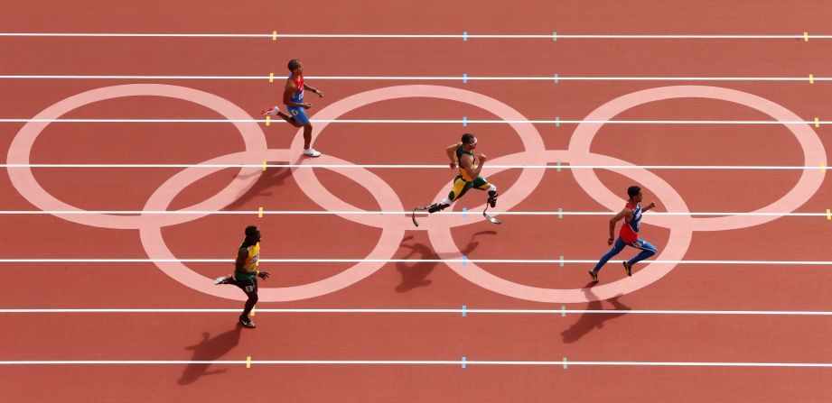 Rusheen McDonald of Jamaica, Luguelin Santos of the Dominican Republic, Oscar Pistorius of South Africa and Maksim Dyldin of Russia compete in the first round of the men's 400-meter on Saturday.